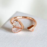 Rock solid stone heart twist rose gold ring (clear/ rose) Size: 7