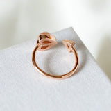 Rock solid stone heart twist rose gold ring (clear/ rose) Size: 7