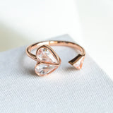 Rock solid stone heart twist rose gold ring (clear/ rose) Size: 7