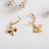 legacy logo spade flower huggies earrings