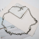 AK silver tone long necklace