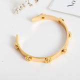 Gold Milgrain Logo Cuff Bracelet
