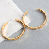 Gold Pierced “T” Logo Hoop Earrings