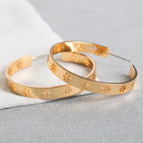 Gold Pierced “T” Logo Hoop Earrings