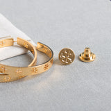 Gold Pierced “T” Logo Hoop Earrings